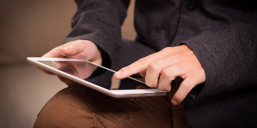 Person using a tablet with touch screen gestures – troubleshooting slow tablet performance